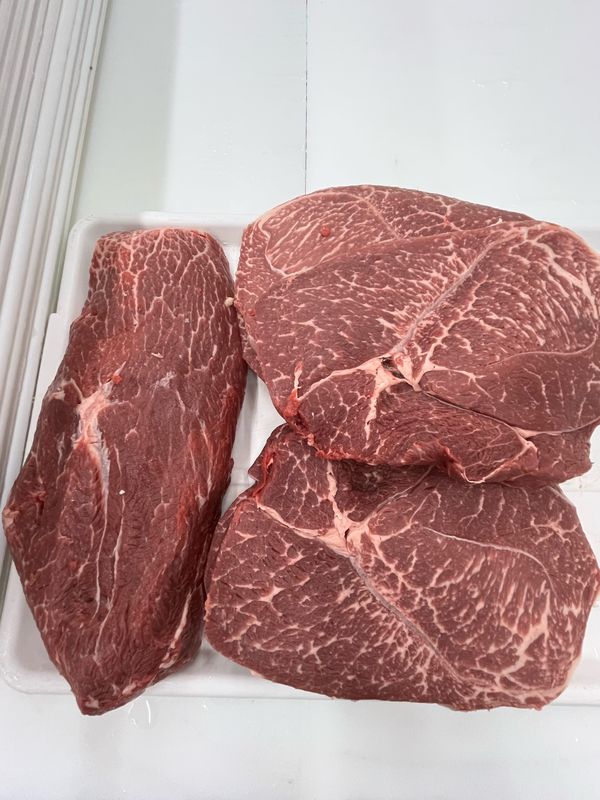Akaushi Wagyu chuck roasts laid out on white butcher paper