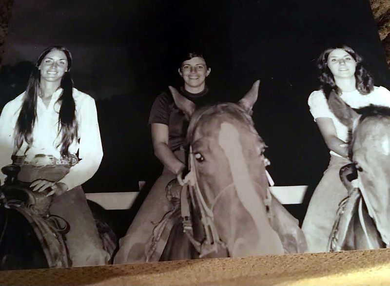 Sepia photo of three young women on horseback